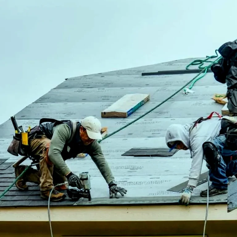 Restoration technician checking ceiling moisture levels for ceiling leak repair Lakeland FL after an HVAC drain line leak.