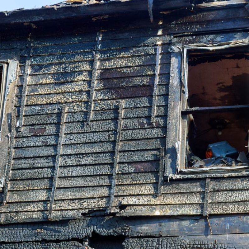 burnt-black-house-after-fire-line-in-front-of-a-de-2022-11-12-11-03-06-utc