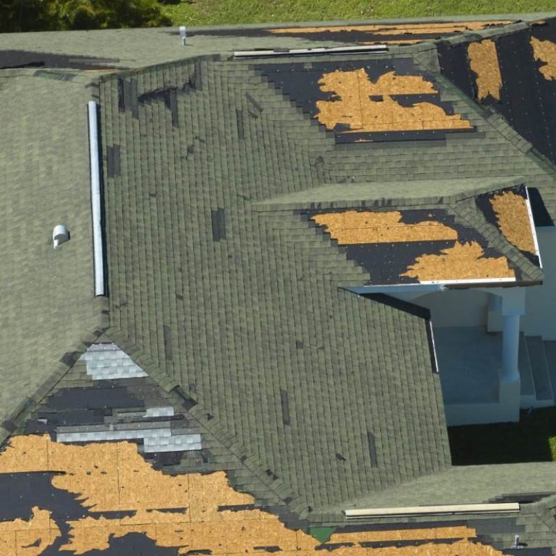 wind-damaged-house-roof-with-missing-asphalt-shing-2023-08-08-04-24-15-utc